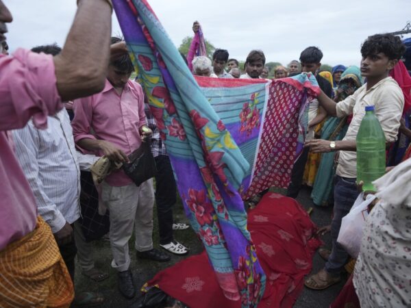 AP PHOTOS: Families of stampede victims in India ponder future without loved ones