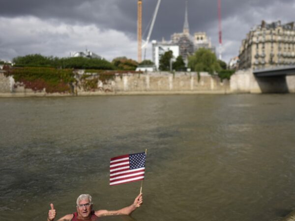 An American swims in Paris' Seine River before the Olympics despite contamination concerns