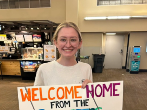 Ashley Paige and her welcome home sign.