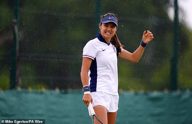 Emma Raducanu wears an England football kit while training at Wimbledon today