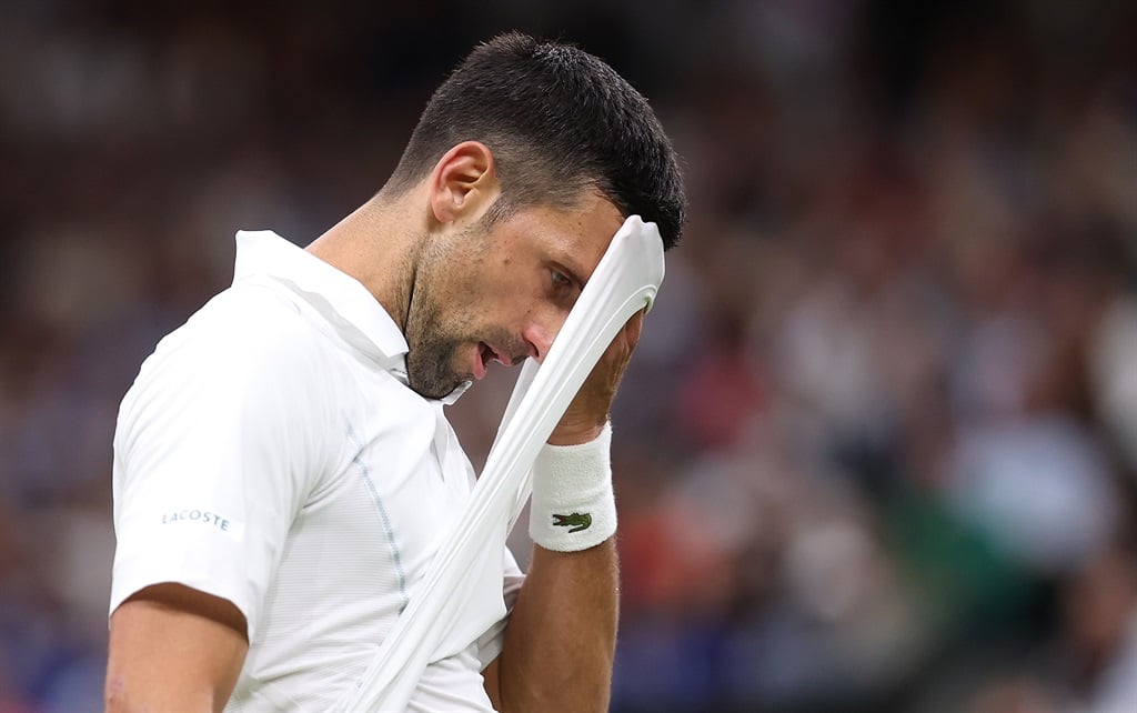 Novak Djokovic of Serbia reacts against Holger Rune of Denmark in his Gentlemens Singles fourth round match during day eight of The Championships Wimbledon 2024 at All England Lawn Tennis and Croquet Club on 8 July 2024 in London, England. (Julian Finney/Getty Images)