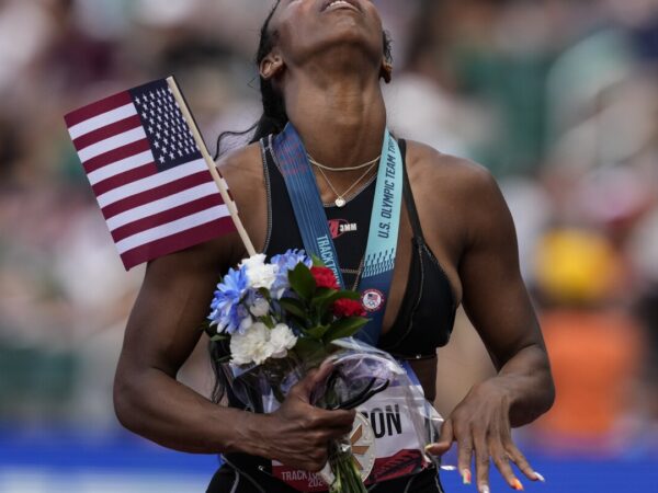 Hurdler Alaysha Johnson earns spot to Paris Games wearing borrowed spikes and uniform she designed