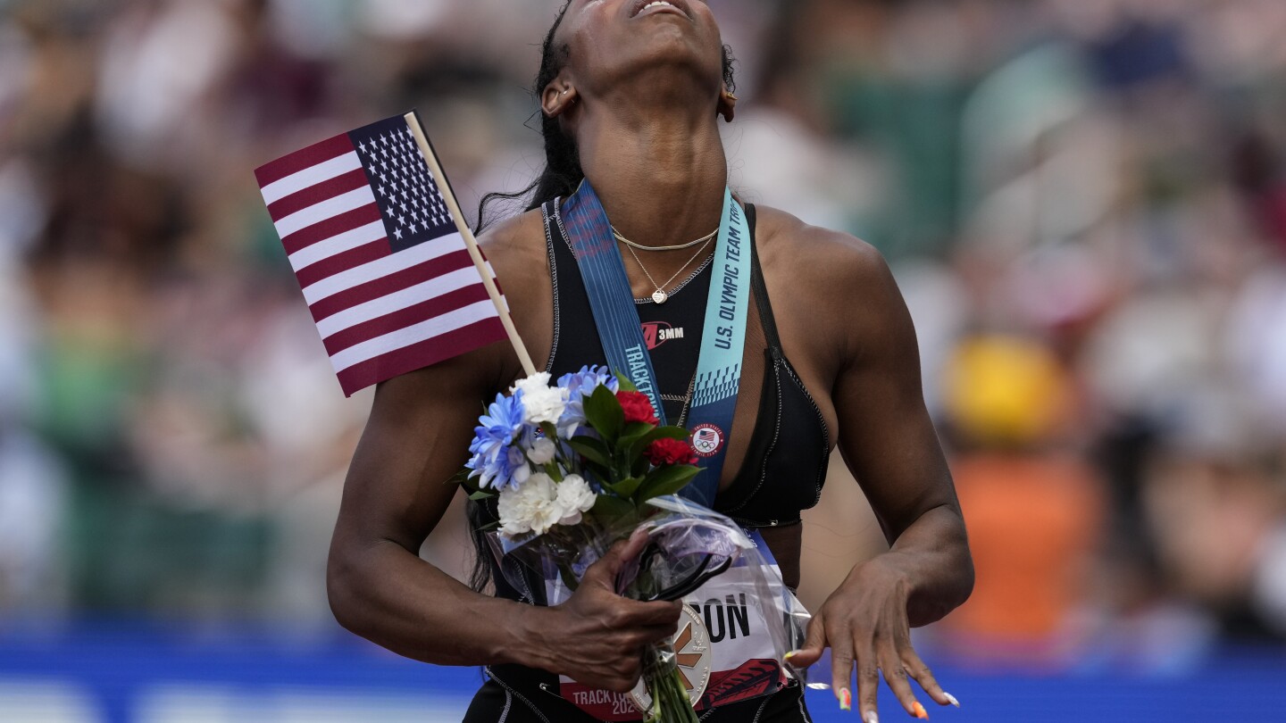 Hurdler Alaysha Johnson earns spot to Paris Games wearing borrowed spikes and uniform she designed