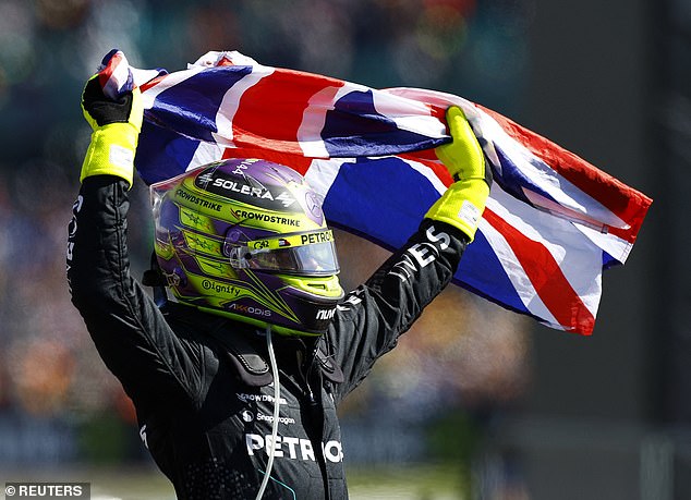 Lewis Hamilton celebrates winning a record extending ninth British Grand Prix at Silverstone