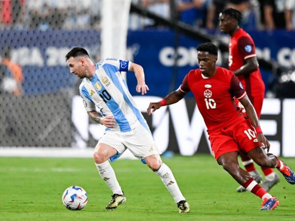 Lionel Messi of Argentina battles for the ball with Jonathan David of Canada during the CONMEBOL Copa America USA 2024 match between Canada and Argentina at MetLife Stadium on 10 July 2024 in East Rutherford, United States. (Pablo Morano/BSR Agency/Getty Images)