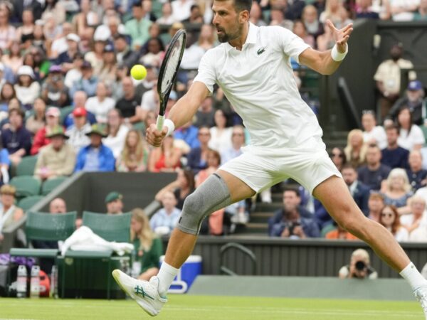 Novak Djokovic wins his first match at Wimbledon with a sleeve on his surgically repaired knee