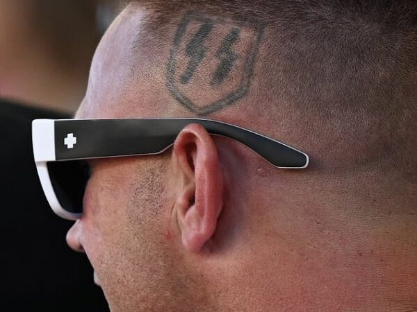 Jonathan Pangburn has the lightning bolt symbol used by the Schutzstaffel - the Nazi guard - tattooed above his left ear, it is now commonly used by white supremacists