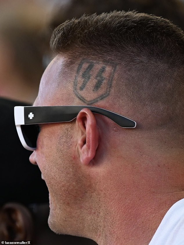 Jonathan Pangburn has the lightning bolt symbol used by the Schutzstaffel - the Nazi guard - tattooed above his left ear, it is now commonly used by white supremacists