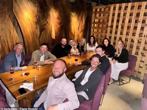 Rory McIlroy (second back left) and Erica Stoll (fourth back right) enjoyed  a night out with his Ryder Cup teammates and their partners in London Sunday night