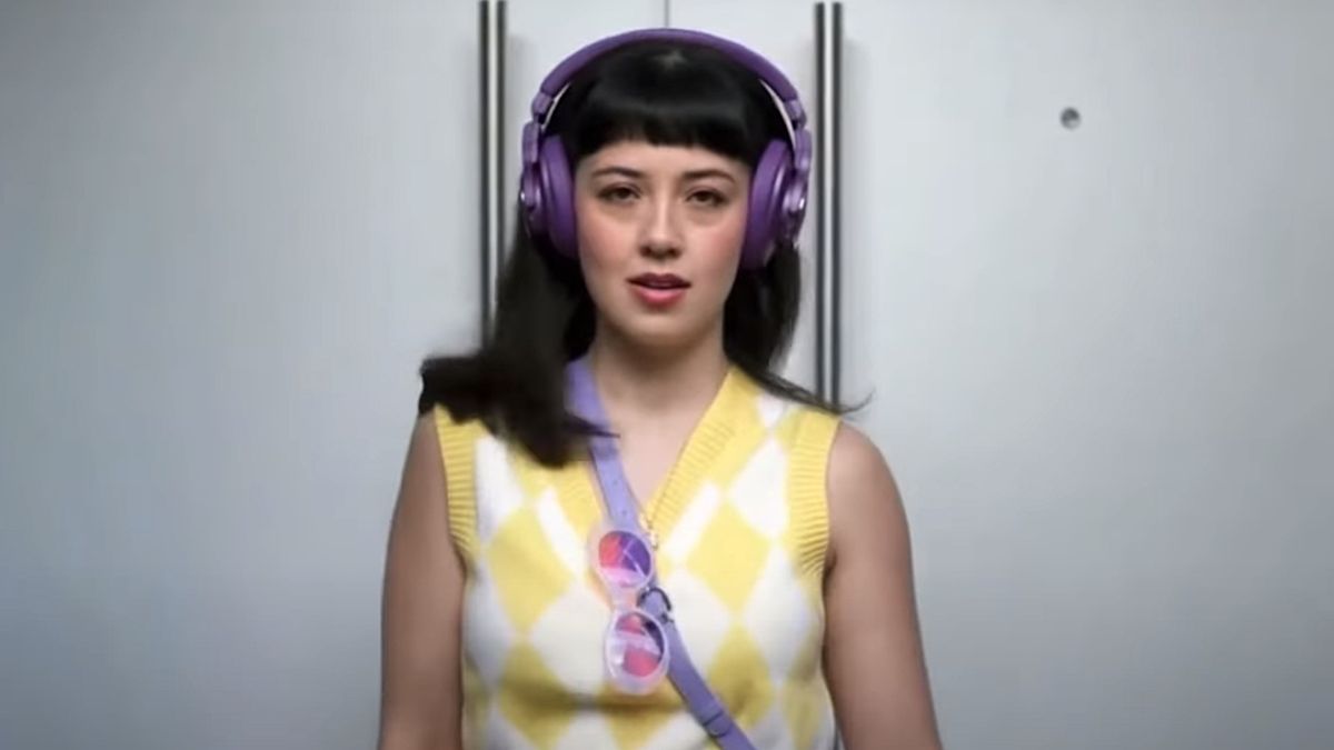 Woman wearing in purple headphones in Allegra commercial