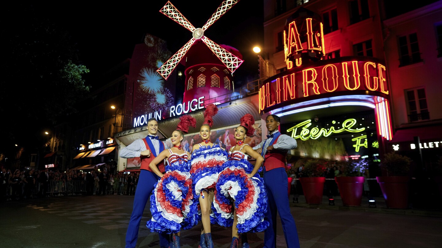 The Moulin Rouge cabaret in Paris has its windmill back, after a stunning collapse