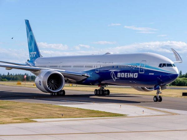 A Boeing 777X readies for its flying display in front of crowds at the Farnborough Airshow, on 20th July 2022, at Farnborough, England