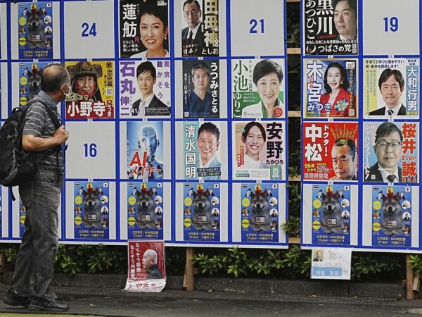 'We have to be wacky.' With suggestive poses and pets, election campaigning tests Tokyo's patience